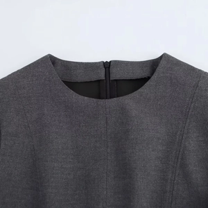 Detail of dark grey midi dress featuring a classic round neck and hidden back zipper