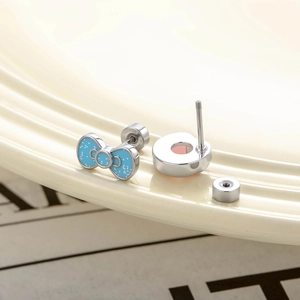 Bow and round screw back cartilage earrings with blue enamel and pink stone detail