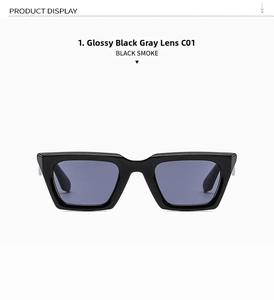 Detail view of square black sunglasses with dark grey lenses and chunky retro frame