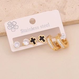 Three-pair set of stainless steel earrings featuring cross studs and gold hoop detail
