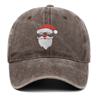 Close-up of Santa Claus embroidery on a distressed brown washed cotton baseball cap