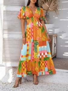 Detail of V-neck and tropical print patchwork on a bohemian short sleeve maxi dress