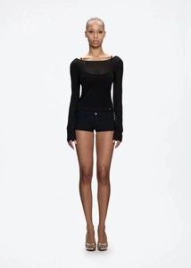 Close-up of black mesh long sleeve sheer top paired with slim fit low-rise hot pants