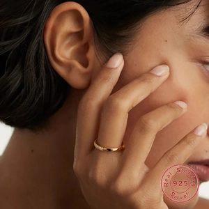 Elegant S925 sterling silver ring with small diamonds and pearls shown on a hand