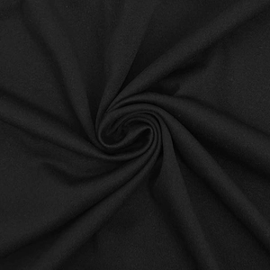 Macro shot of black breathable sports fabric texture with spiral folds and soft shadows