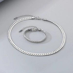 Macro detail of silver S925 snake bone chain necklace and bracelet jewelry set