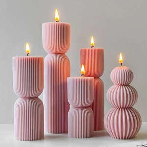 Pink striped pillar and ball scented candles with realistic flame and textured surface
