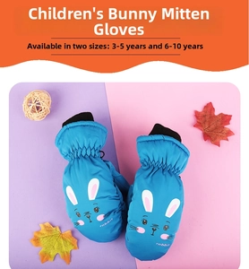 Detail view of blue waterproof winter mittens for kids with cute cartoon rabbit prints