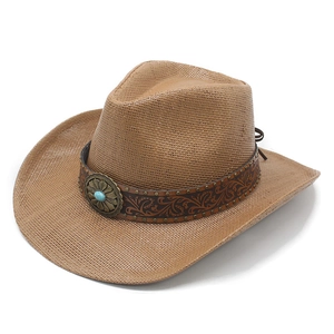 Detail of western straw cowboy hat featuring turquoise stone and embossed leather band