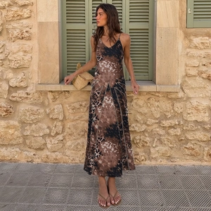 Detail shot of the V-neck straps and leopard print fabric on this slim maxi dress