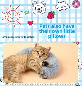 Detailed view of light blue plush pet neck pillow with crescent shape for small cats