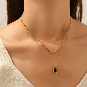Double-layered gold-plated stainless steel necklace featuring a black square pendant