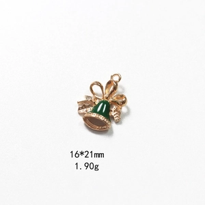 Detail view of 16x21mm green enamel Christmas bell pendant with golden bow and ring