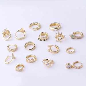 Set of 14 pairs of gold plated geometric earrings with cubic zirconia in various designs