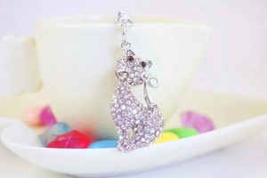 Detailed macro of a silver fox-shaped keychain encrusted with sparkling rhinestones