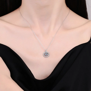 Elegant S925 sterling silver round pendant necklace with 1ct moissanite on model