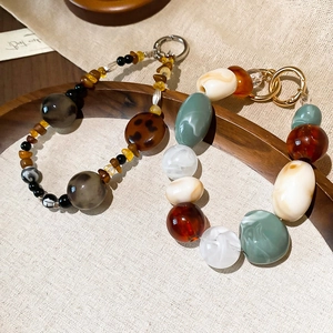 Bohemian acrylic marbled beaded keychain with vintage charms and metallic ring detail