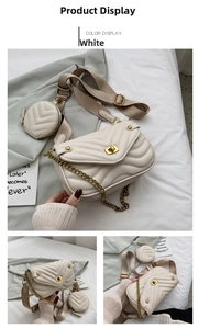 Detail view of white quilted crossbody bag with gold chain and matching round coin purse