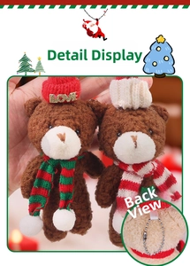 Detail showing two plush teddy bears with festive Christmas hats and striped scarves