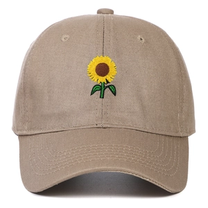 Detailed embroidery of a yellow sunflower on a khaki cotton canvas baseball cap