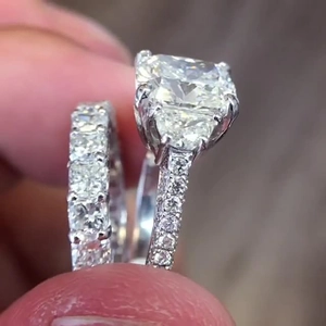 Macro detail of high-quality square cut solitaire ring with micro-pave sterling silver band