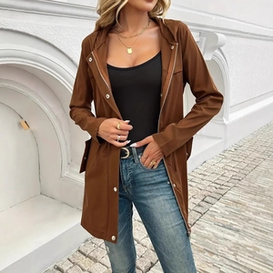 Detail of a brown hooded windbreaker with drawstring waist and large flap pockets