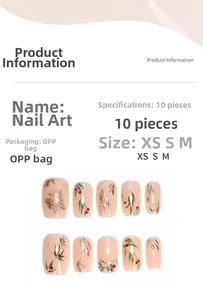 Detailed view of handmade press-on nails with golden butterfly and floral patterns