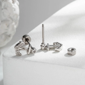 Silver anchor shaped stud earrings with sparkling cubic zirconia and flat screw back