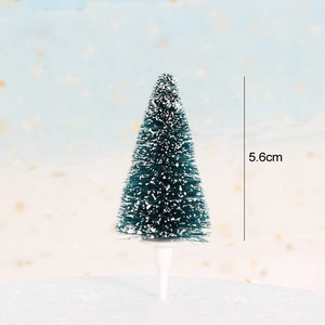Detailed view of a 5.6cm mini Christmas tree cake topper with snow effect and white base