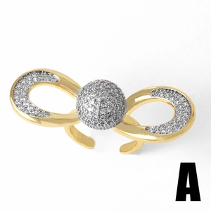 Adjustable gold plated bow ring with sparkling pavé cubic zirconia on white background
