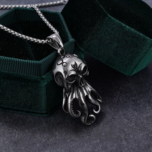Close-up of vintage stainless steel octopus skull pendant with detailed tentacles