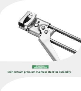 Detail of adjustable stainless steel jar opener showing serrated grip and brushed metal texture