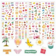 Close-up of cute cartoon stickers with hearts and plants for planners and DIY journals