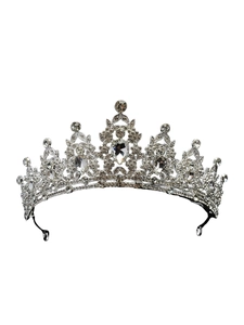 Macro shot of silver alloy wedding crown featuring intricate white rhinestone inlay