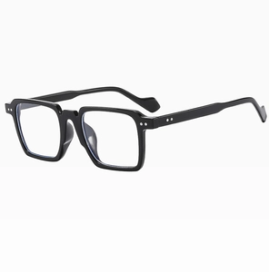 Detail view of black square chunky frames with silver rivet accents and clear lenses