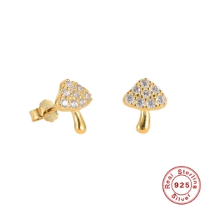 Macro view of gold-plated S925 sterling silver mushroom studs with cubic zirconia