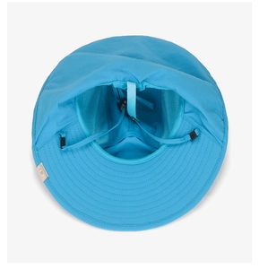 Macro shot of breathable mesh lining and adjustable wind cord on blue sun hat