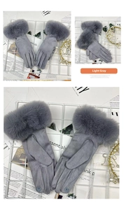 Detail view of light gray thermal gloves with faux fur cuffs and touchscreen embroidery