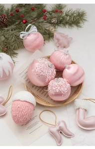 Detailed collection of pink Christmas ornaments including sequins and faux pearl ball charms