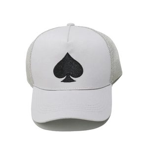 Close-up of light gray trucker hat featuring spade embroidery and breathable mesh back