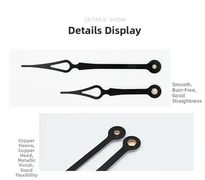 Close-up of black metal quartz clock hands with reinforced copper bushing detail