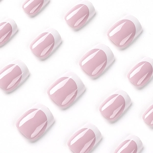Short square French press-on nails with pink base and white tips on white background