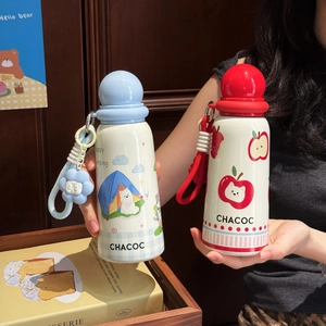 Detail of insulated water bottle with cute cartoon dog illustration and carry strap