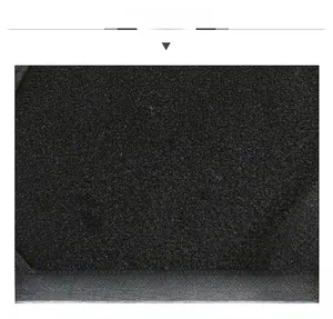 Close-up of black textured fabric on winter baseball cap with thick thermal insulation