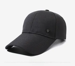 Detail view of cotton baseball cap side with metal shield logo and 1991 embroidery