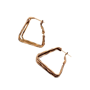 Polished gold plated geometric earrings with minimalist twisted square design on white background