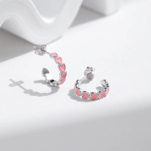 Elegant S925 sterling silver hoop earrings with pink enamel heart patterns for women