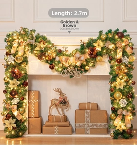 Detailed view of 270cm golden and brown Christmas garland with LED lights and ornaments