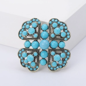 Vintage bronze flower brooch with blue turquoise beads and intricate filigree details