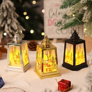 Trapezoid Christmas LED lanterns with Santa, snowman and reindeer prints on faux snow